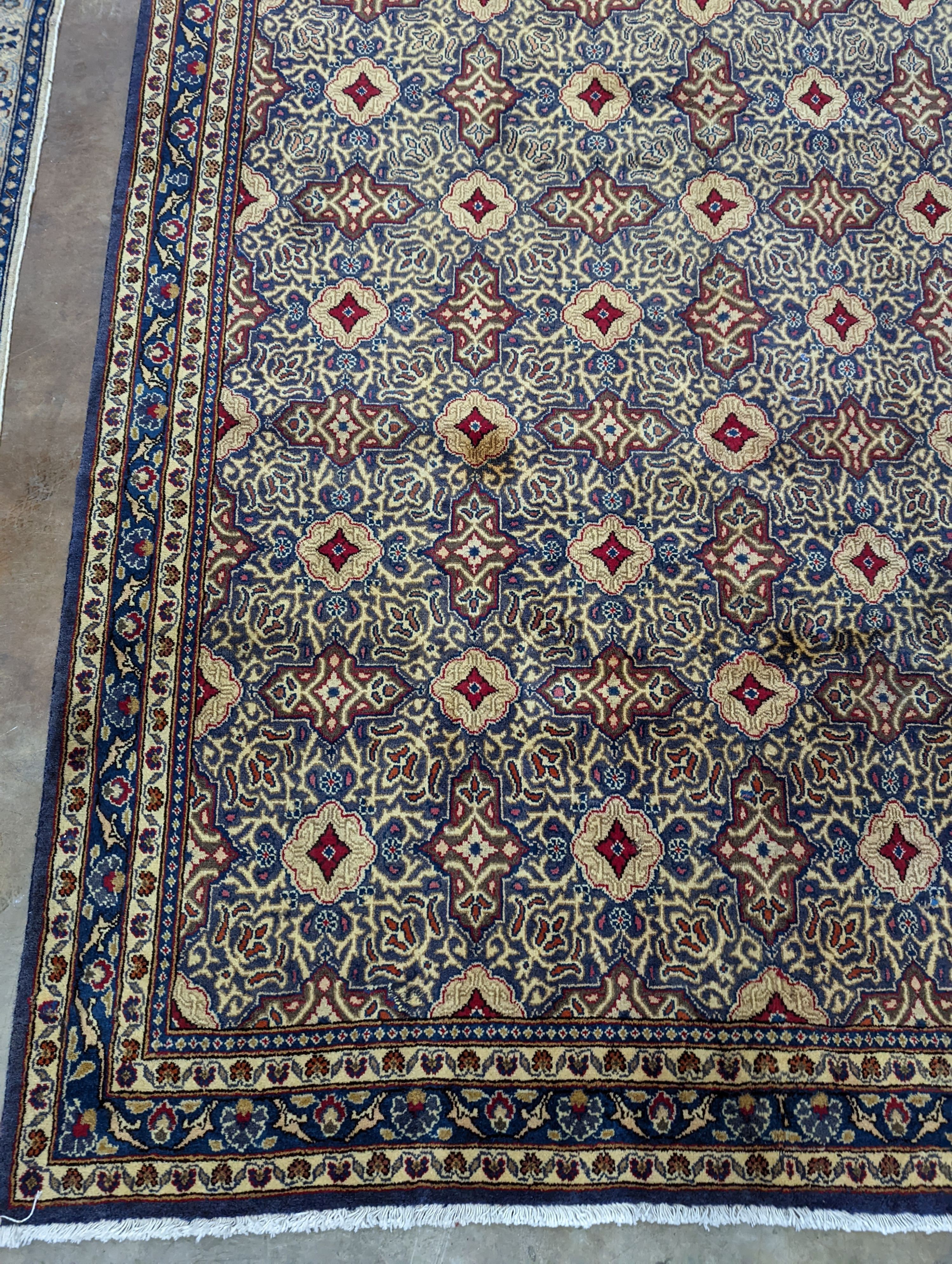 A meshed blue ground carpet, 290 x 190cm